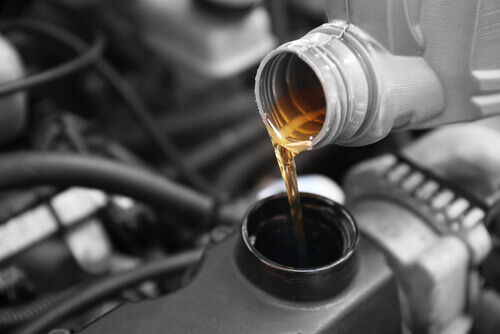 Pouring Synthetic Oil to Car Engine - City Subaru