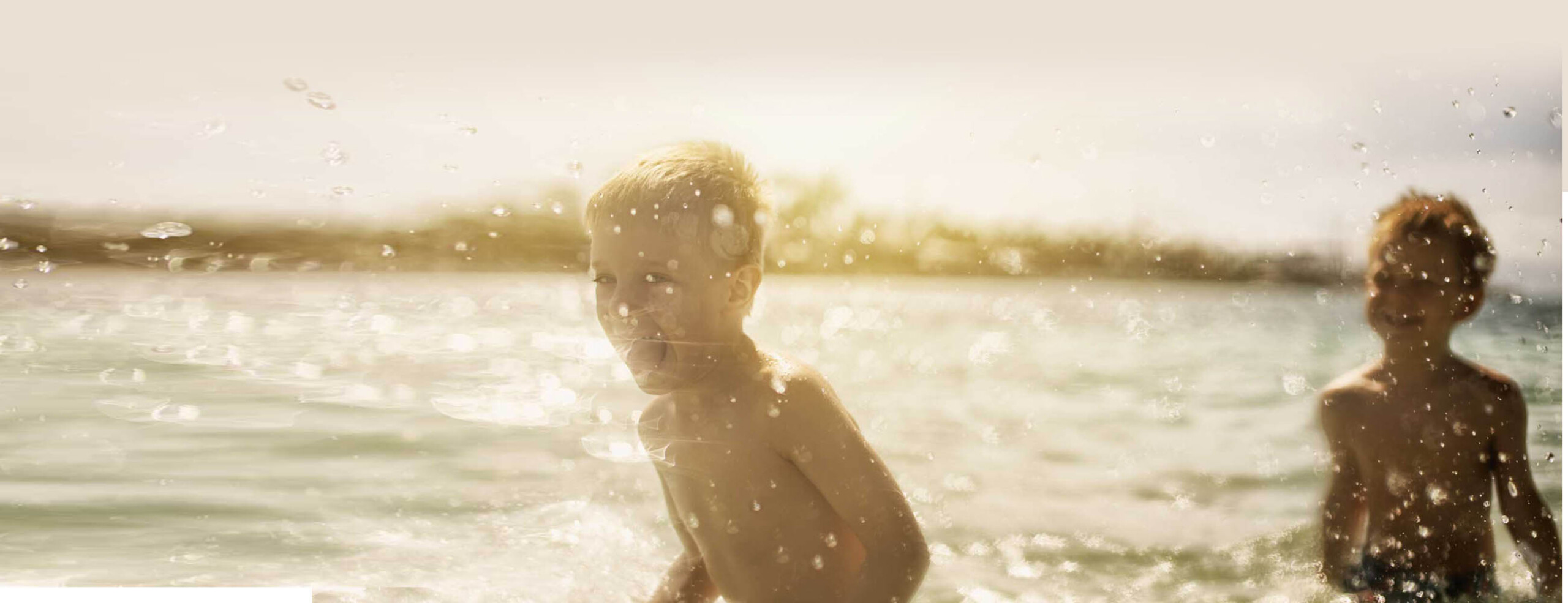 A Boy in Water with Bubbles