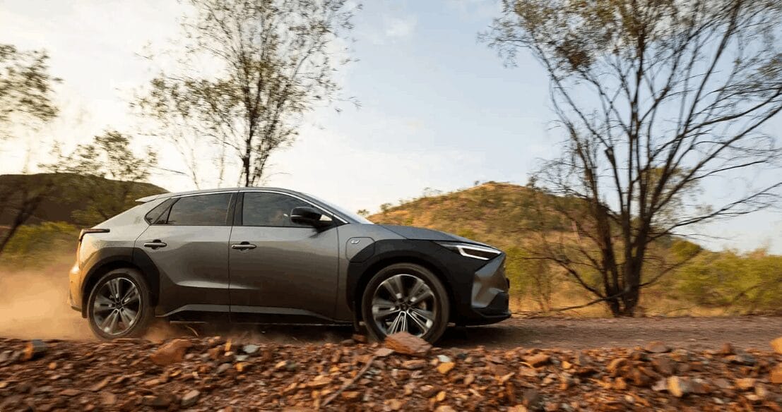 Grey Subaru Solterra navigating an off-road trail through the Australian bush