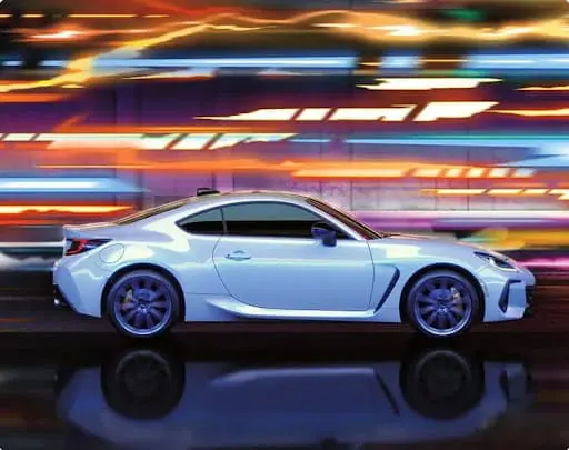White Subaru BRZ captured from the side, speeding through a tunnel with colorful motion effects