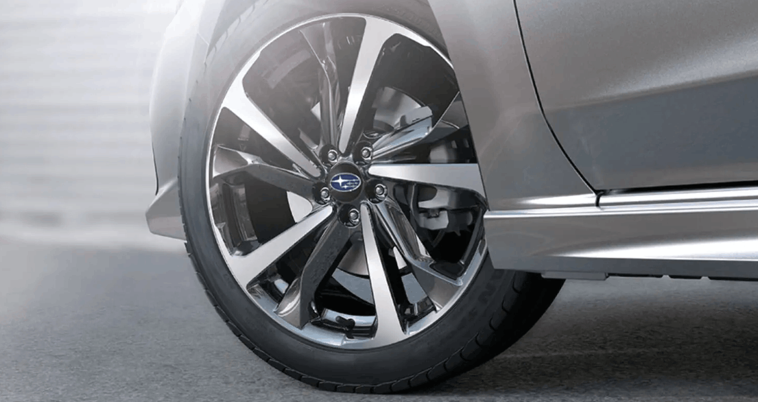 Close-up of Subaru alloy wheel and tyre showing detailed rim design on a parked vehicle