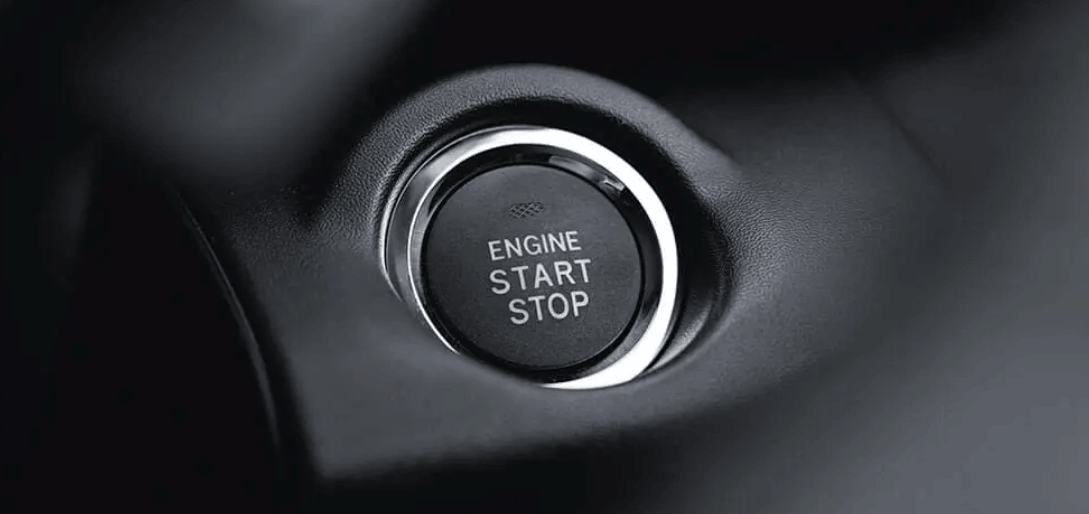 Close-up of push-button engine start and stop control inside a Subaru vehicle interior