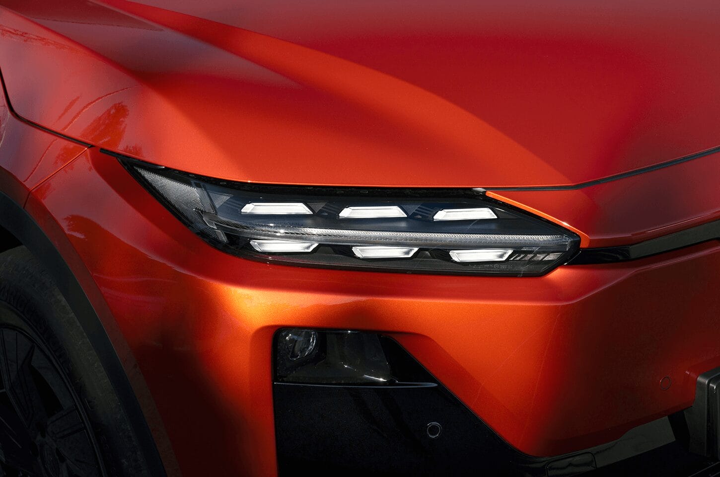 Close-up of the Subaru Uncharted LED headlight design and sculpted front exterior styling.
